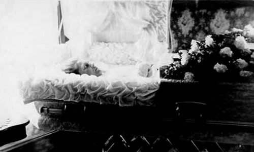 woman corpse dead body in casket coffin